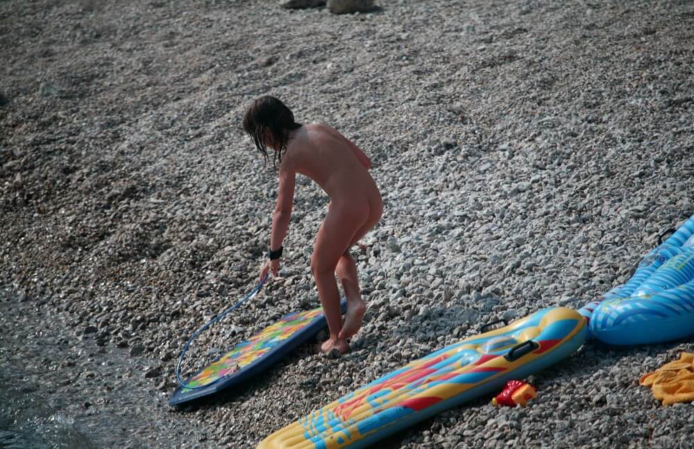 Naturist Surf Board Glides pics - Lightheartedness and ease are characteristic features of the practice of nudism and naturism