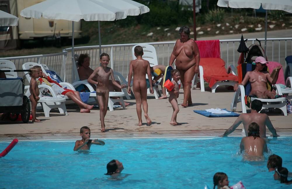 Naturist Afternoon Pool Games pics - Joy and pleasure are part of the nudist experience