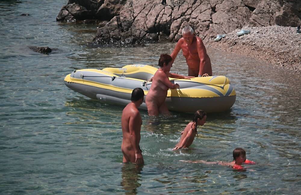 Lone Nudist in Yellow Boat photos - For naturists, nudity is part of natural existence