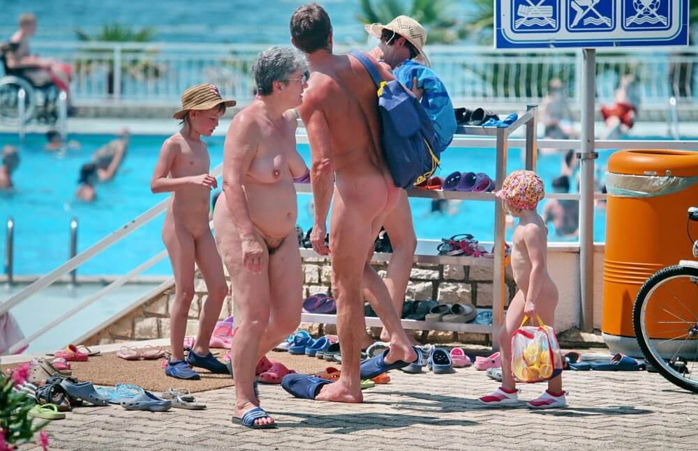 Family Poolside Grouping pics - Overcoming inhibitions is one of the goals of nudism