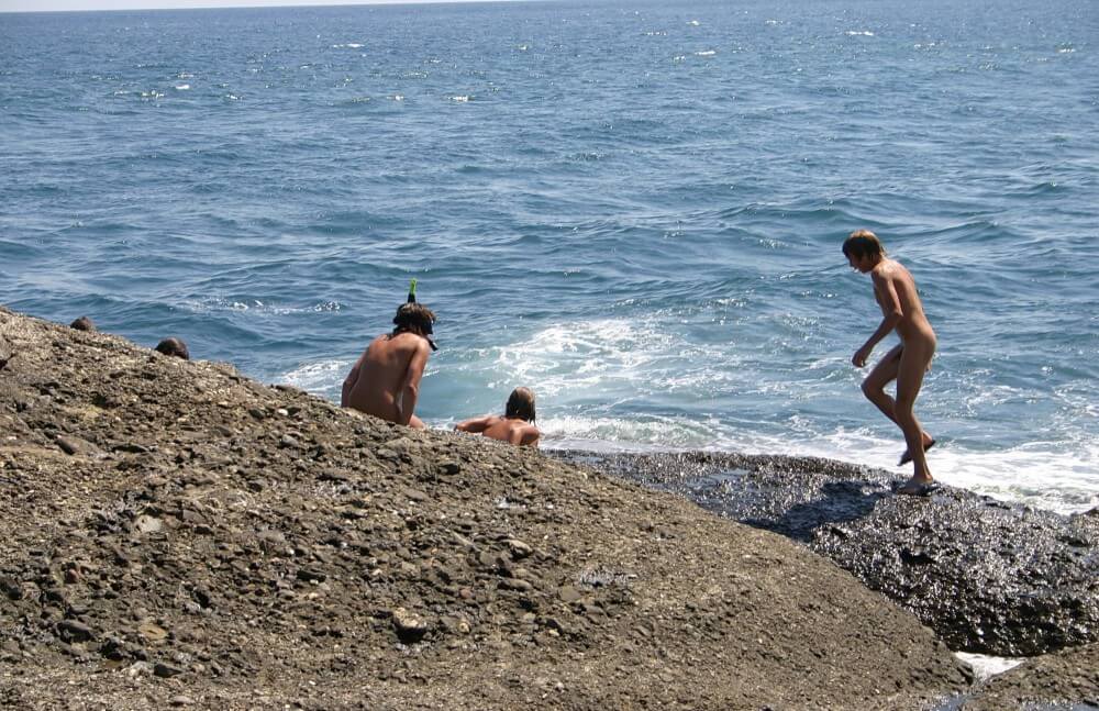 Leaning Against Hit Rocks pics - Nudism and naturism help us break free from imposed stereotypes